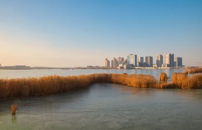 Yinchuan new commercial district over frozen chenjia lake.