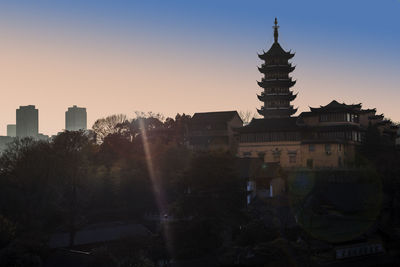 Panoramic view of city against sky at sunset