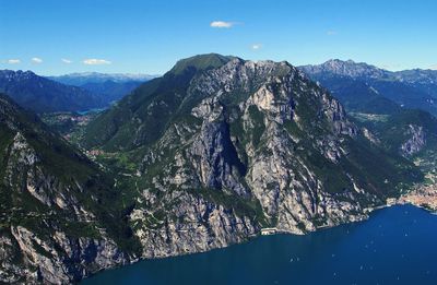 Scenic view of mountains against blue sky