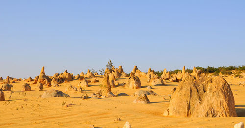 Panoramic view of desert against clear sky