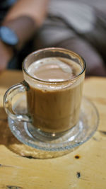 Close-up of coffee cup on table