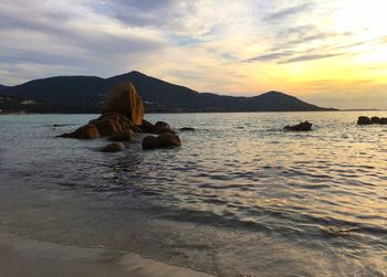 Scenic view of sea against sky at sunset