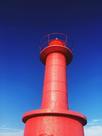 Low angle view of lighthouse against blue sky