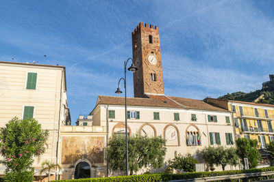  houses with beautiful facades and bell tower in noli