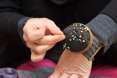 Midsection of man holding ice cream
