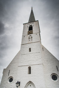 Low angle view of clock tower against sky