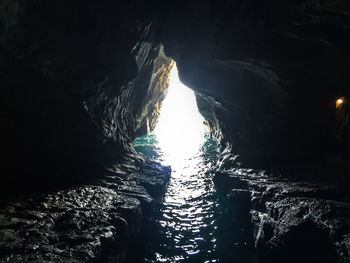 Low angle view of illuminated lighting equipment in water