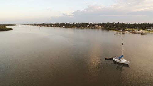 High angle view of nautical vessel on river against sky
