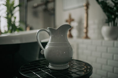 Luxury interior of big bathroom at modern african style with oval bathtub in natural lighting