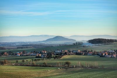 View of landscape against blue sky