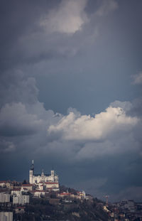 Buildings in city against sky