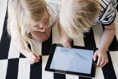Children using digital tablet