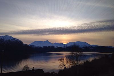 Scenic view of mountains against cloudy sky