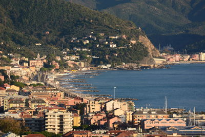 High angle view of townscape by sea