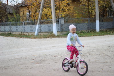 Portrait of girl riding bicycle