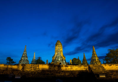 Temple against building and blue sky
