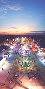 View of illuminated city at sunset