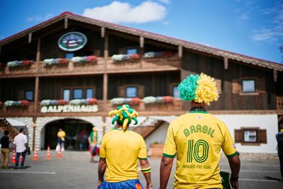 Rear view of fans walking on street