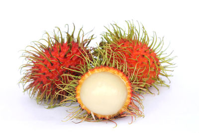 Close-up of strawberry over white background