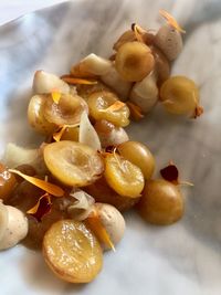 High angle view of fruits in plate on table