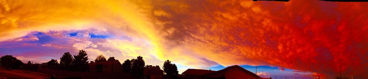 Scenic view of dramatic sky at sunset