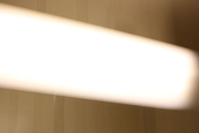 Close-up of illuminated lights on wall at home