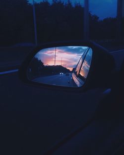 Reflection of car on side-view mirror