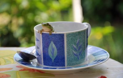 Close-up of coffee cup on table