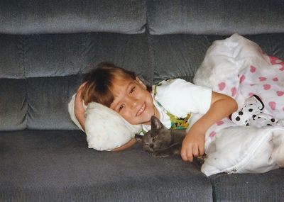 Portrait of girl lying on bed