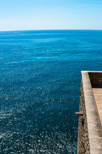 High angle view of sea against blue sky