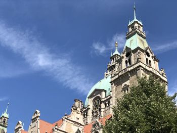 Low angle view of buildings against blue sky