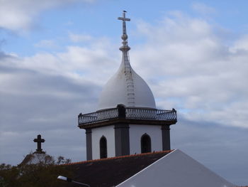 Low angle view of historical building against cloudy sky