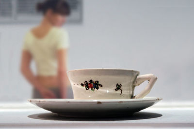 Close-up of tea cup on table