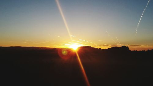 Sun shining over landscape