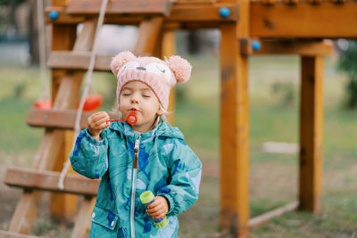 Portrait of cute girl playing with toys