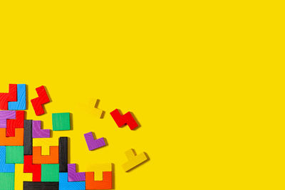 Close-up of toys against yellow background