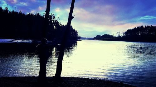 Scenic view of lake at sunset