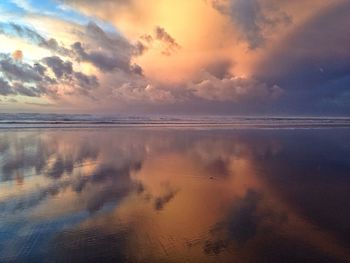 Scenic view of sea against cloudy sky