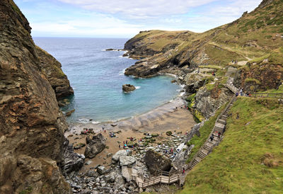 High angle view of rocks on sea against sky