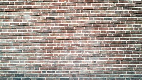 Low angle view of brick wall