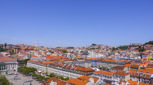 High angle view of townscape against clear blue sky