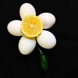 Close-up of fruits against black background