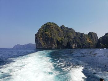 Scenic view of sea against clear blue sky