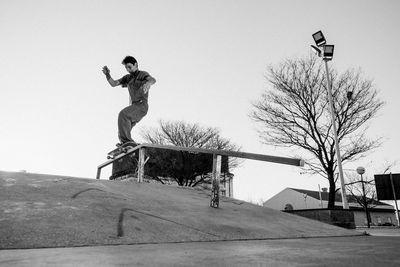 Portrait of skateboarder making a trick