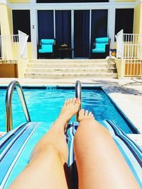 Low section of woman holding swimming pool