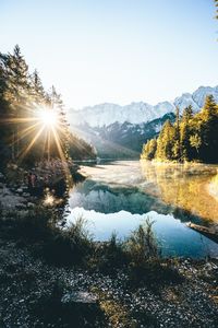 Scenic view of lake and mountains against sky