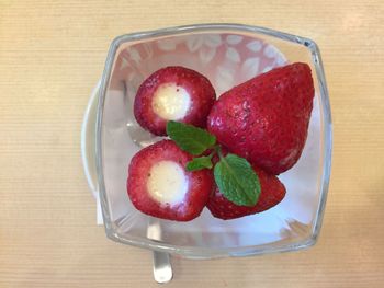 Directly above shot of strawberries in glass on table