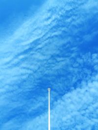 Low angle view of smoke stack against sky