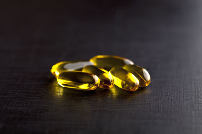 Close-up of cod liver oil capsule on table