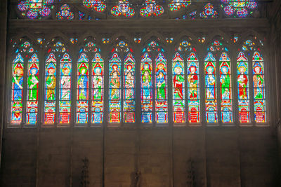 Low angle view of multi colored glass window of building